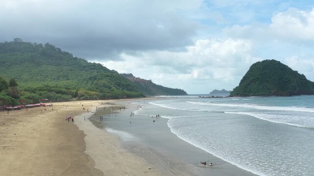People enjoying a beautiful tropical beach in java