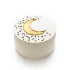 White cake with moon and stars decoration.