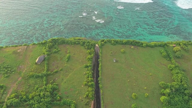 Scenic aerial view of coastal road Tanah barak and turquoise ocean in bali