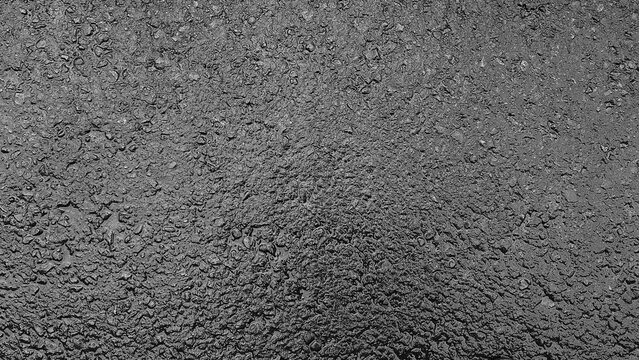 Wet asphalt texture background in monochrome tones