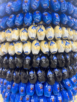 BELO HORIZONTE, MG, BRAZIL, FEBRUARY 19, 2026. A mesmerizing vertical stack of foil-wrapped chocolate Easter eggs creates a colorful pattern in a grocery store aisle.