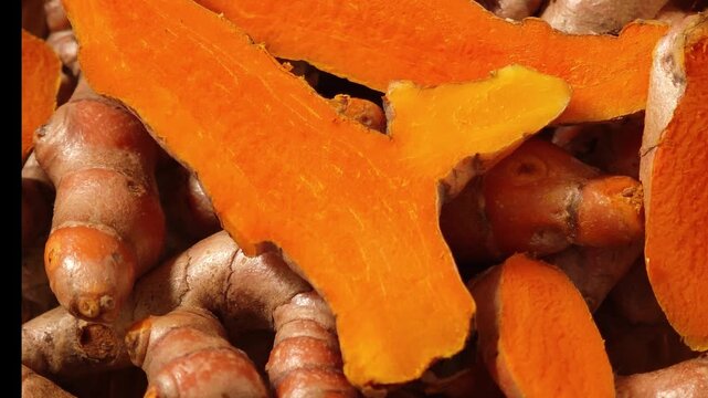 Fresh turmeric in a wooden basket.