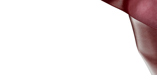 A close-up shot of an abstract burgundy fabric corner with beautiful texture details isolated on white. © vegefox.com