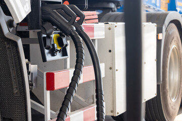 EV charging and semi truck electric vehicle, Electric vehicle semi truck trailer charging station for charge EV battery, Plug for vehicle electric engine, EV charger semi truck trailer station.