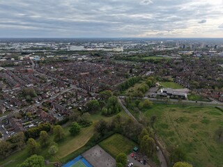 Fototapeta premium City skyline and suburban landscape captured from above during a cloudy afternoon in early spring