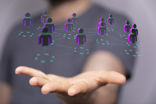 Visual representation of interconnected individuals. Networking concept with digital humans on a hand, symbolising coll