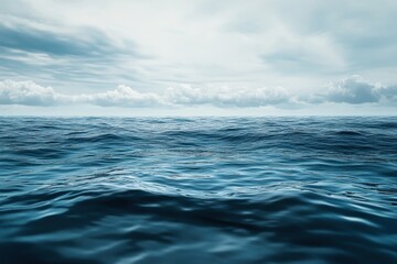 Fototapeta premium Calm ocean waves under cloudy sky during the day