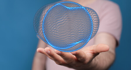 Abstract image of hand holding a digital sphere, representing the concept of data, communication,...