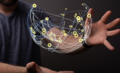 Fototapeta premium Abstract image of a person holding a glowing network sphere representing global connection, digital data, and technolog