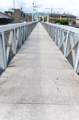 Pedestrian footbridge over a river with no people.