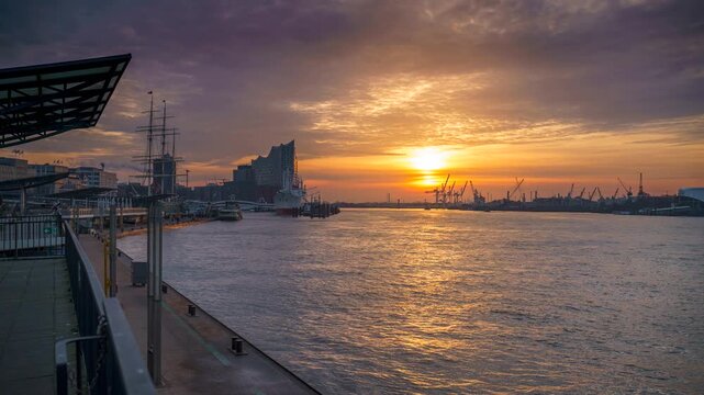Cinematic timelapse of sunrise over Hamburg harbor with ships and Elbphilharmonie