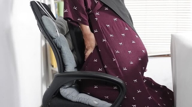 Pregnant women with lower back pain and discomfort, fatigue. Concepts of lifestyle and pregnancy health care. Hormonal changes in pregnant women.
