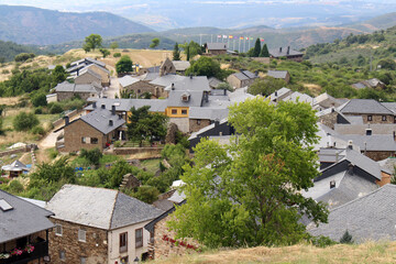 Fototapeta premium Approaching El Acebo de San Miguel from the Mountain Above Manjarin July 2024