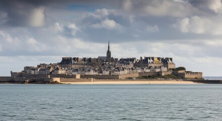 Fototapeta premium Fortified island city of Saint-Malo, France, surrounded by sea and sand