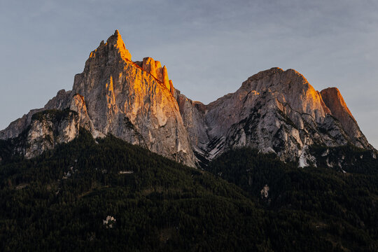 Majestic Alpenglow on the Sciliar (Schlern) mountain peak at sunset, Dolomites, South Tyrol, Italy