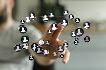 Hand reaching out to interact with a digital network, representing online social connections and business networking.