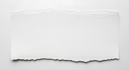 Obraz premium Torn white paper texture with rough edges on gray background with subtle shadow effect visible