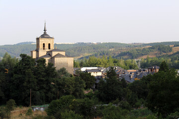 Obraz premium Iglesia de San Nicolas de Bari and Puente Romano de Molinaseca at Sunrise July 2024 Church tower