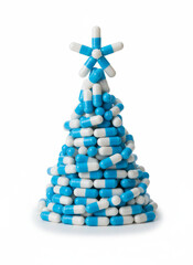 Pills forming a christmas tree with star medicine concept