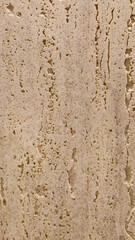 Obraz premium Natural beige travertine stone texture with vertical organic pits, premium limestone surface background