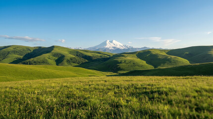 Fototapeta premium Green Foothills Leading to Distant Mountain