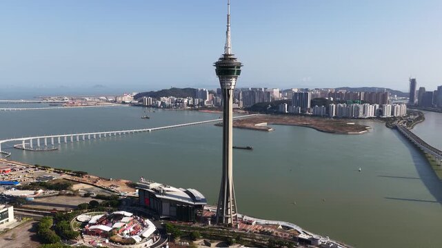 Aerial drone flying around macau tower china