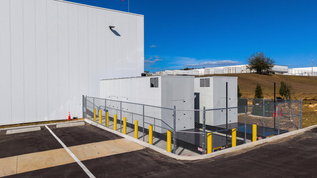 Two standby diesel generators outside warehouse	