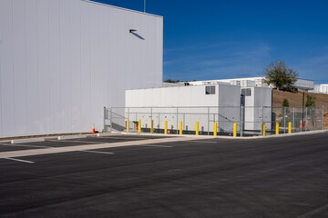 Fototapeta premium Two standby diesel generators outside warehouse 