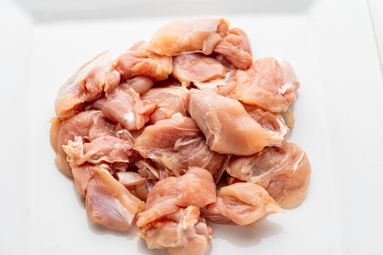 Strips of raw chicken or turkey breast, skinless and boneless chicken breast. Chicken breast is a high-protein food.