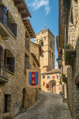 Medieval stone street and church tower in Ainsa Huesca Spain
