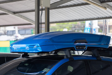 Trunk or cargo box on the roof of the car. Travel, family vacation. Accessories for transportation. travel Car Equipped with Roof Box.