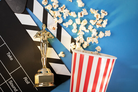 oscar nominee, statue award with popcorn and a movie clapperboard, academy prize and salty treat representing cinematic excellence,Moscow, Russia, January 21, 2025