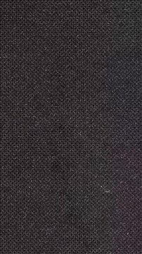 Dark Textured Fabric Surface Close-up abstract background