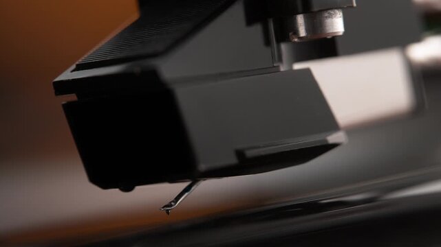 Turntable Stylus Attached to the Phono Cartridge Lowering onto the Spinning Vinyl Record in Macro and Slow Motion - Listening Room