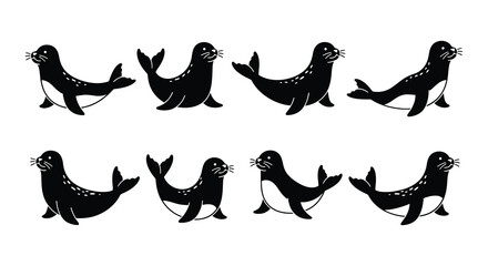 A collection of black silhouette seals playfully swimming in a group © Begum