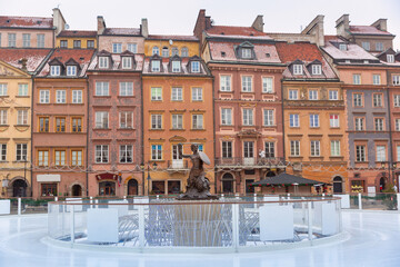 Frozen ice rink around the Mermaid statue at the Old Town Market Square in Warsaw © Kavalenkava