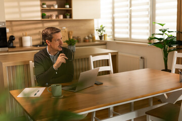 Man Thinking While Working At Home