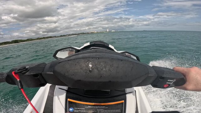 Riding personal watercraft on the shores of Rio Hato in Panama on vacation fun ocean play