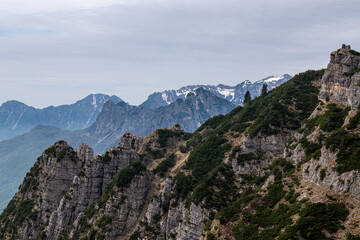 Obraz premium Dramatic mountain peaks and clouds view from Mount Pasubio, Italian Prealps.