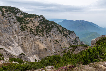 Fototapeta premium Dramatic mountain peaks and clouds view from Mount Pasubio, Italian Prealps.