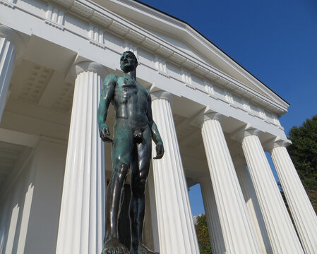 The Theseus Temple in Vienna's Volksgarten is a Grecian-style temple built in 1819-1923. The art nouveau statue of handsome necked aryan man, Vienna, Austria.