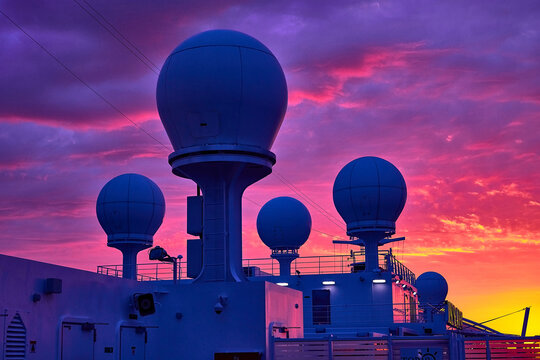 Vibrant Sunset Over Ship's Radomes