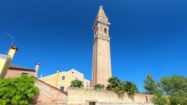 The leaning bell tower on the island of Burano in the Venice lagoon, Italy. Because of land subsidence it is inclined of 1.83 meters respect to its axis.