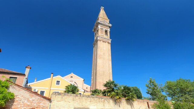 The leaning bell tower on the island of Burano in the Venice lagoon, Italy. Because of land subsidence it is inclined of 1.83 meters respect to its axis.