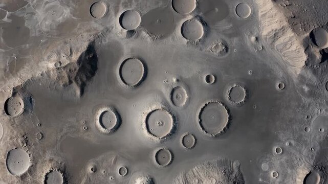 Aerial view of lunar impact craters and smooth basalt plains background, view from above