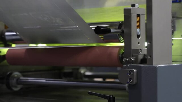 High resolution Industry printer close up. Industrial inkjet printer in operation. printing pattern on large sheet of fabric or paper. Automate printer for modern printing and digital print technology