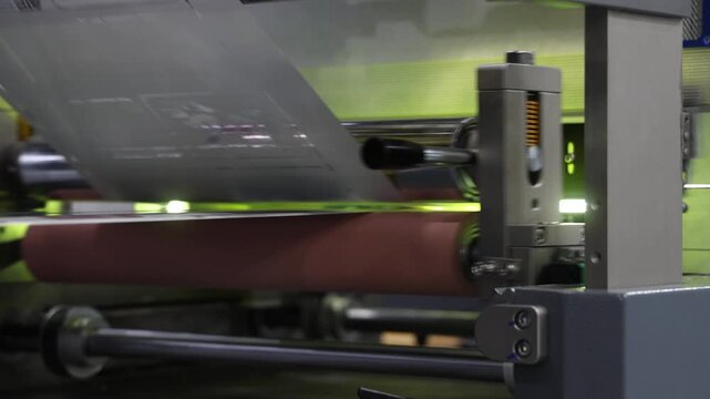 High resolution Industry printer close up. Industrial inkjet printer in operation. printing pattern on large sheet of fabric or paper. Automate printer for modern printing and digital print technology