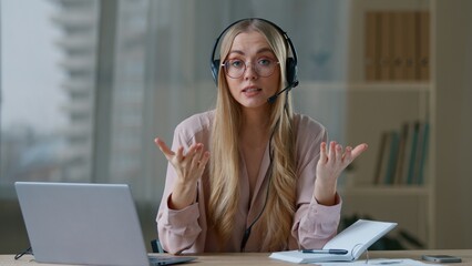 Caucasian business woman online distant coach in headset talking looking to camera businesswoman...