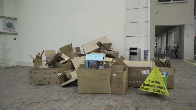 Karton sammelplatz Schweiz. Well-organized cardboard recycling point in Schaffhausen, Switzerland. Sustainable waste management and eco-friendly. Karton Sammelstelle in Altstadt. Recycling. 
