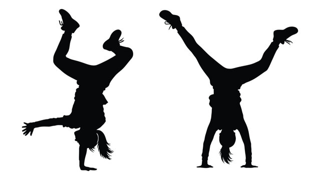 Two silhouetted figures performing handstands capturing dynamic movement and athletic pose